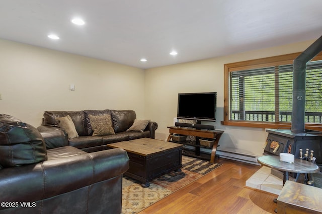 2821 Basingdale Blvd Unit 4, Vail, CO 81657 - living area with a wood stove, wood finished floors, and recessed lighting
