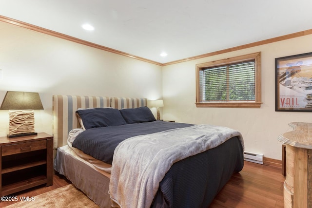 2821 Basingdale Blvd Unit 4, Vail, CO 81657 - bedroom featuring wood finished floors, baseboard heating, ornamental molding, baseboards, and recessed lighting