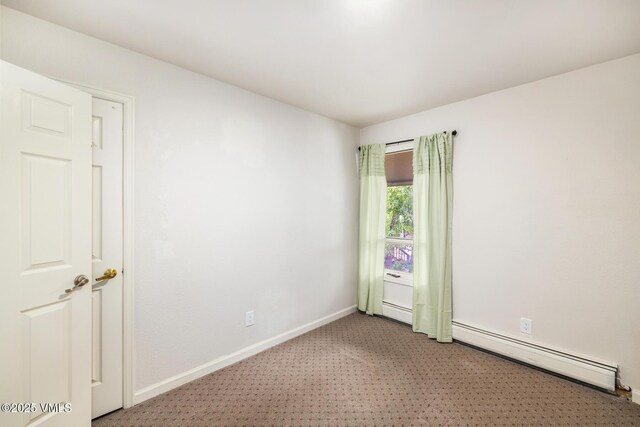 929 Red Sandstone Rd Unit 15D, Vail, CO 81657 - unfurnished room with a baseboard radiator and light carpet
