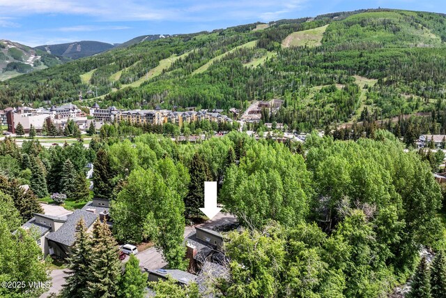 929 Red Sandstone Rd Unit 15D, Vail, CO 81657 - drone / aerial view of a heavily wooded area and a mountainous background
