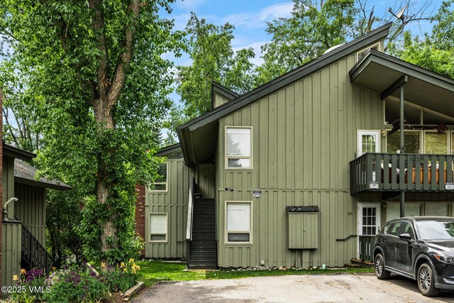 929 Red Sandstone Rd Unit 15D, Vail, CO 81657 - view of side of property featuring stairway, a balcony, and board and batten siding