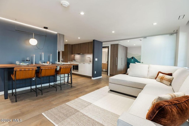 174 Gore Creek Dr Unit 268, Vail, CO 81657 - living area featuring light wood-style flooring and recessed lighting