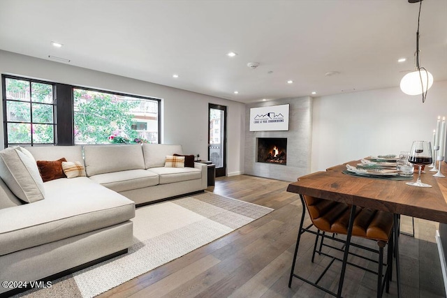174 Gore Creek Dr Unit 268, Vail, CO 81657 - living area with healthy amount of natural light, wood finished floors, recessed lighting, and a large fireplace