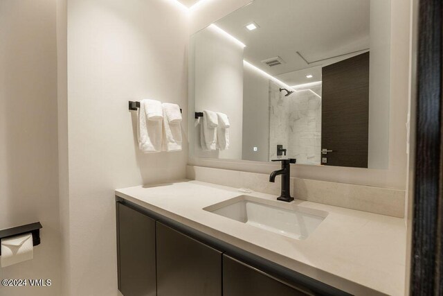174 Gore Creek Dr Unit 268, Vail, CO 81657 - bathroom featuring vanity, a shower, and recessed lighting