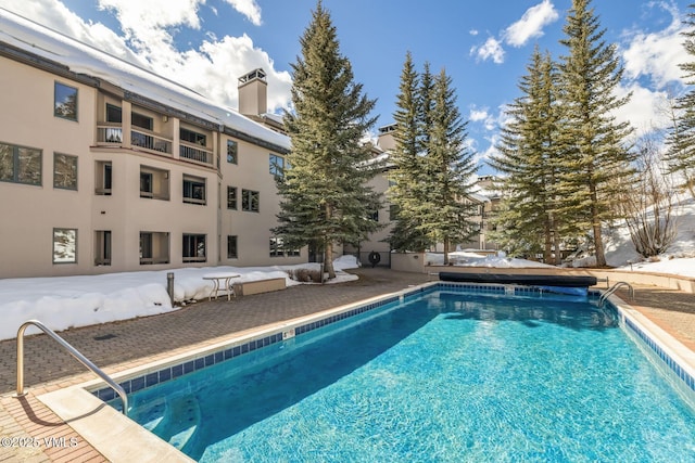 community pool with a patio