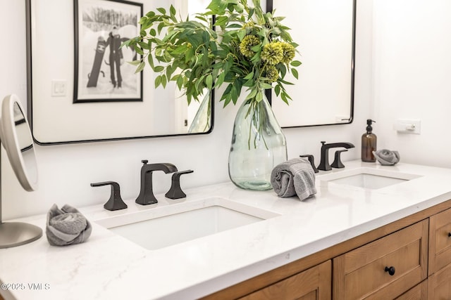 bathroom featuring double vanity and a sink