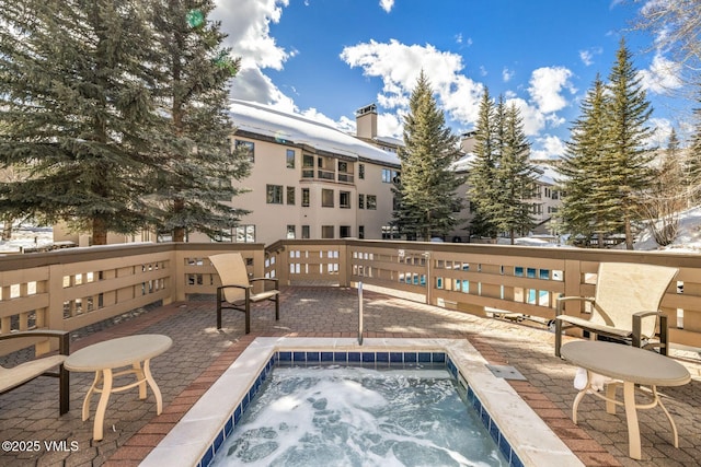 view of pool with a community hot tub and a patio