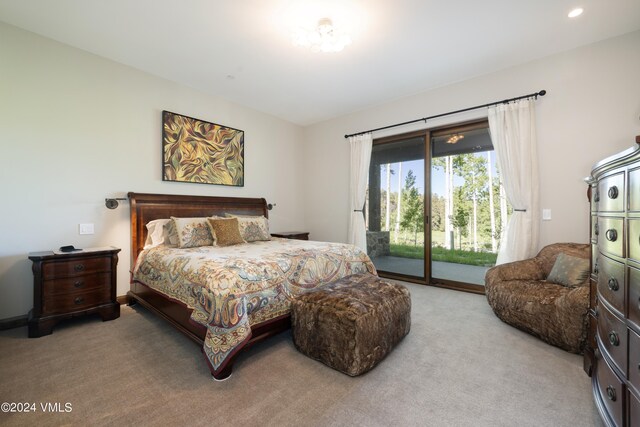 bedroom with access to exterior, recessed lighting, and light colored carpet