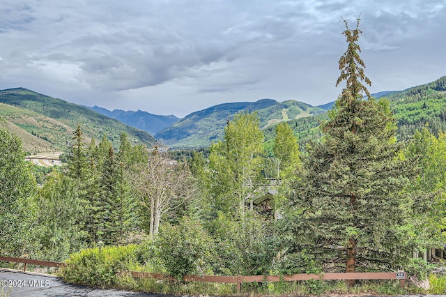 1370 Sandstone Dr # 12, Vail, CO 81657 - view of mountain backdrop featuring a forest