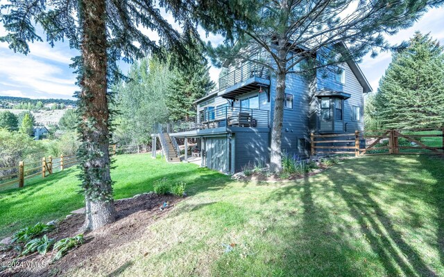 view of yard with a wooden deck