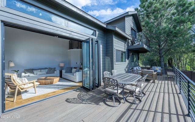 wooden deck with an outdoor hangout area