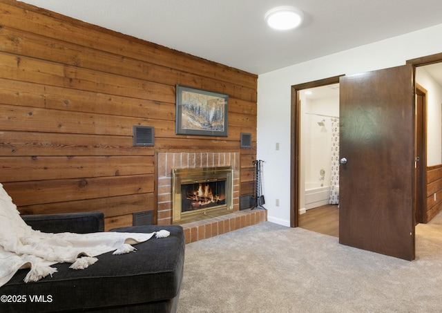 54 Columbine Cir Unit 14, Eagle-Vail, CO 81620 - carpeted living room with wooden walls and a fireplace