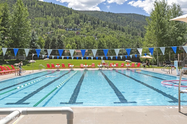 54 Columbine Cir Unit 14, Eagle-Vail, CO 81620 - community pool featuring a wooded view and a mountain view