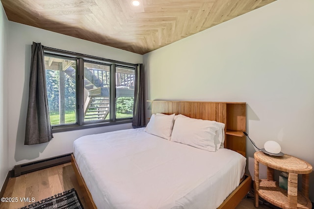 1750 S Frontage Rd W Unit E-3, Vail, CO 81657 - bedroom featuring a baseboard radiator and wood finished floors