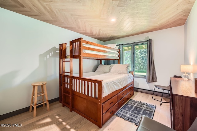 1750 S Frontage Rd W Unit E-3, Vail, CO 81657 - bedroom featuring a baseboard radiator and light wood finished floors