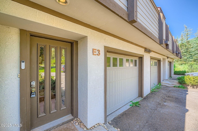 1750 S Frontage Rd W Unit E-3, Vail, CO 81657 - property entrance with stucco siding and an attached garage