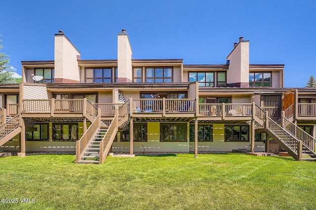1750 S Frontage Rd W Unit E-3, Vail, CO 81657 - back of property with stairway, a deck, and a chimney