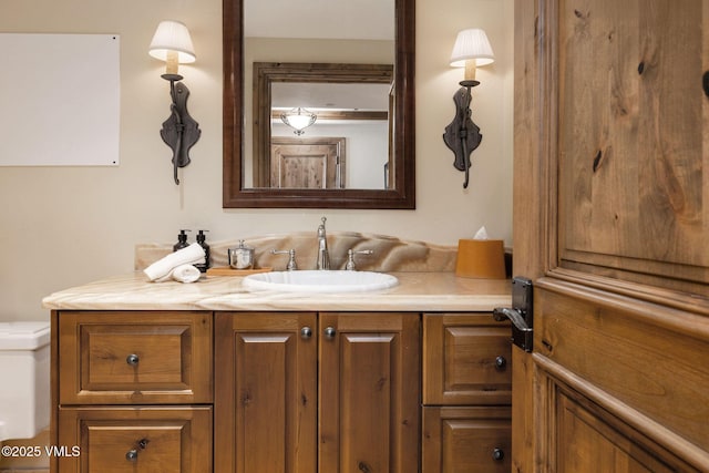 bathroom with vanity and toilet