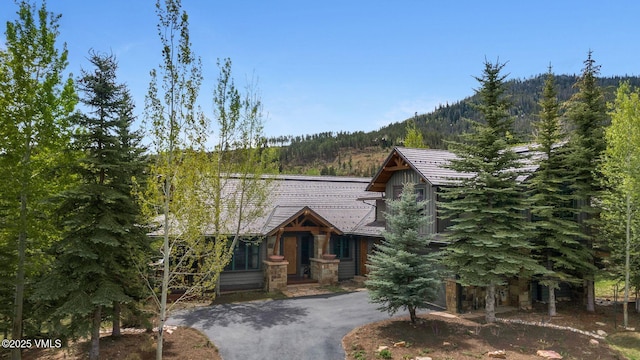 124 Grey Hawk Ln, Edwards, CO 81632 - view of front of home with a forest view and a mountain view