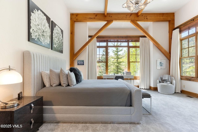 124 Grey Hawk Ln, Edwards, CO 81632 - carpeted bedroom with a chandelier and beamed ceiling