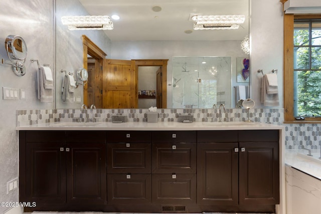 124 Grey Hawk Ln, Edwards, CO 81632 - full bathroom featuring a shower stall, tasteful backsplash, and double vanity