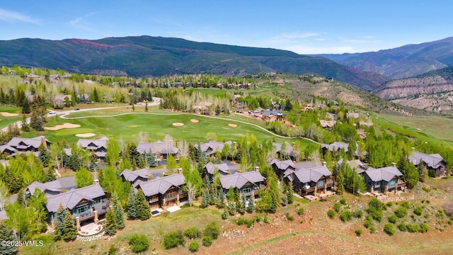 124 Grey Hawk Ln, Edwards, CO 81632 - aerial view of property's location featuring a mountain backdrop, nearby suburban area, and a golf club