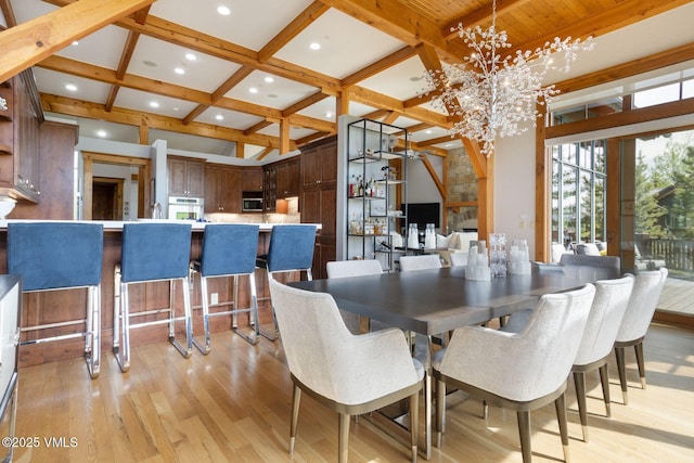 124 Grey Hawk Ln, Edwards, CO 81632 - dining room with beamed ceiling, light wood-type flooring, coffered ceiling, a chandelier, and recessed lighting