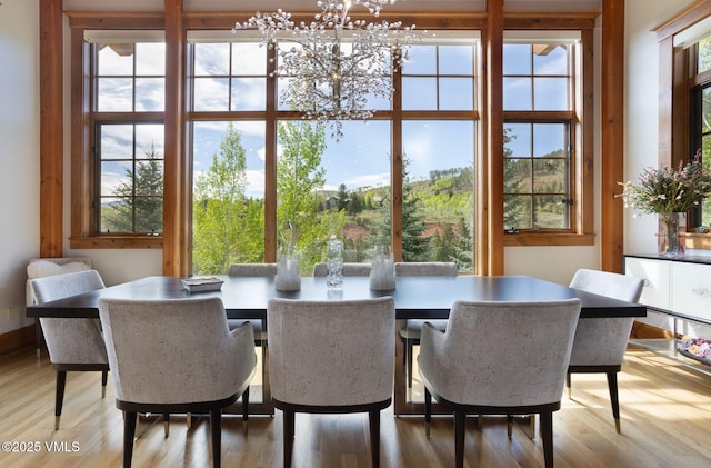 124 Grey Hawk Ln, Edwards, CO 81632 - dining room with a chandelier and light wood finished floors