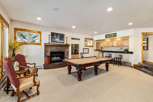 rec room with billiards, indoor bar, a stone fireplace, and carpet floors