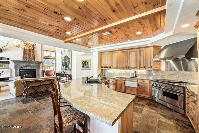 kitchen featuring sink, light stone countertops, decorative backsplash, wooden ceiling, and range with two ovens