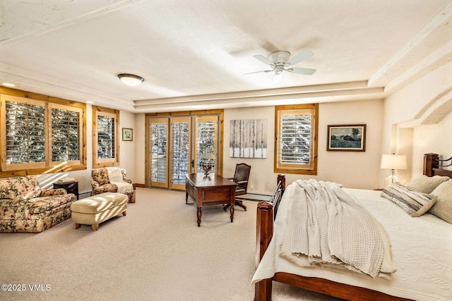 carpeted bedroom with multiple windows, access to outside, and baseboard heating