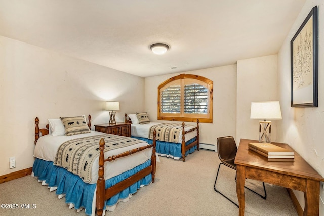 bedroom featuring baseboard heating and light colored carpet