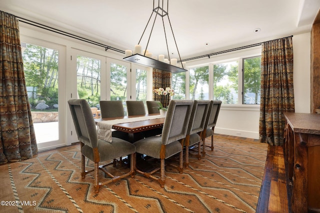 2005 Wildwood Rd, Avon, CO 81620 - dining area featuring a chandelier and wood finished floors