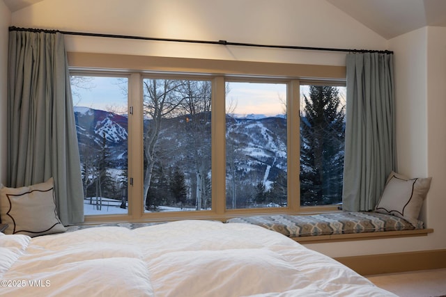 2005 Wildwood Rd, Avon, CO 81620 - bedroom featuring lofted ceiling, a mountain view, multiple windows, and access to exterior