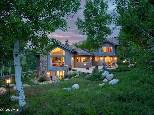 2005 Wildwood Rd, Avon, CO 81620 - back of house at dusk with a yard