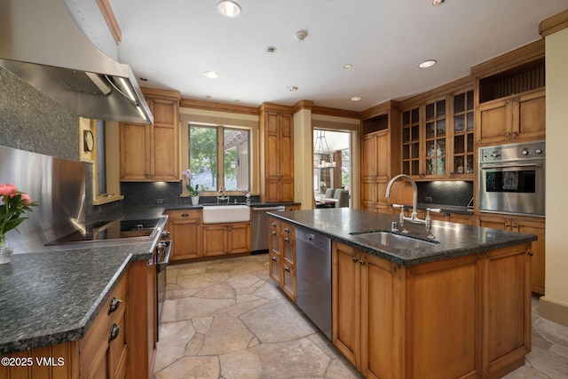 2005 Wildwood Rd, Avon, CO 81620 - kitchen with appliances with stainless steel finishes, island exhaust hood, stone tile floors, an island with sink, and brown cabinets
