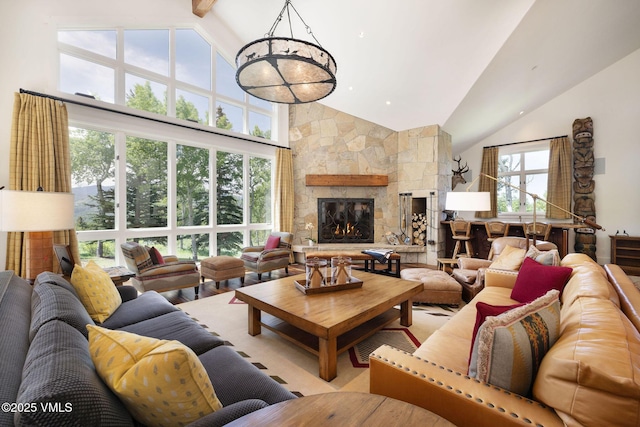 2005 Wildwood Rd, Avon, CO 81620 - living room featuring high vaulted ceiling, a stone fireplace, and beamed ceiling