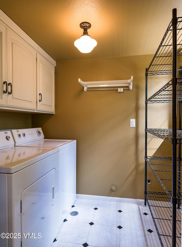 130 Morgan Dr Unit B, Edwards, CO 81632 - laundry room featuring separate washer and dryer, cabinet space, and baseboards