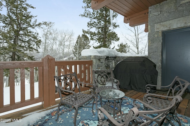 view of snow covered deck