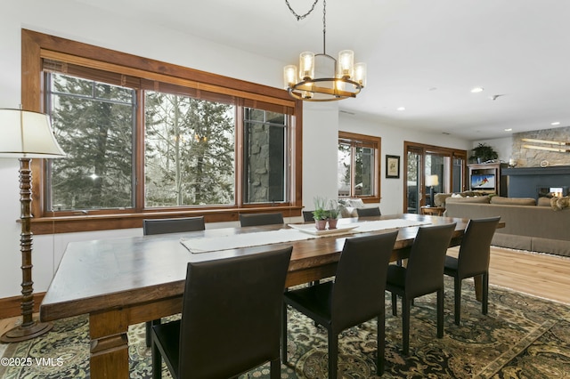 dining room with wood-type flooring and a chandelier