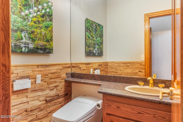 60 Elk Track Ct, Beaver Creek, CO 81620 - half bath with vanity, a wainscoted wall, and tile walls