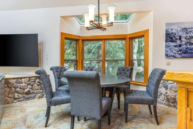 60 Elk Track Ct, Beaver Creek, CO 81620 - dining space with stone tile floors and a chandelier