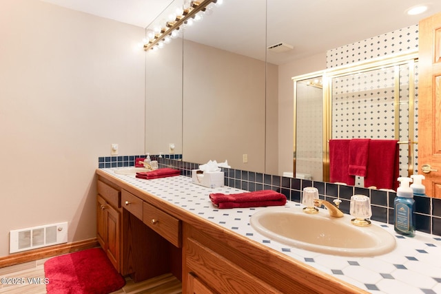 60 Elk Track Ct, Beaver Creek, CO 81620 - bathroom featuring double vanity and backsplash