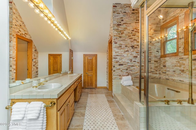 60 Elk Track Ct, Beaver Creek, CO 81620 - full bathroom featuring double vanity, a bath, and lofted ceiling