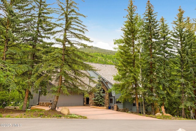 60 Elk Track Ct, Beaver Creek, CO 81620 - view of property hidden behind natural elements featuring driveway and stone siding