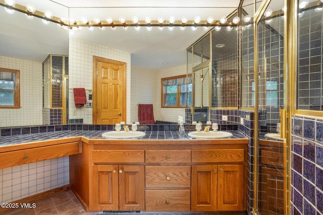 60 Elk Track Ct, Beaver Creek, CO 81620 - full bathroom with double vanity, tile patterned flooring, decorative backsplash, and a tile shower