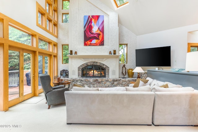 60 Elk Track Ct, Beaver Creek, CO 81620 - living room featuring high vaulted ceiling, plenty of natural light, carpet, a glass covered fireplace, and a skylight