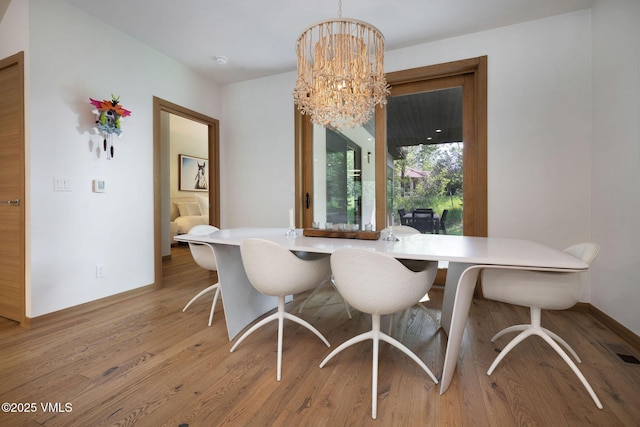 232 Stetson Dr, Edwards, CO 81632 - dining room with light wood-type flooring and a chandelier