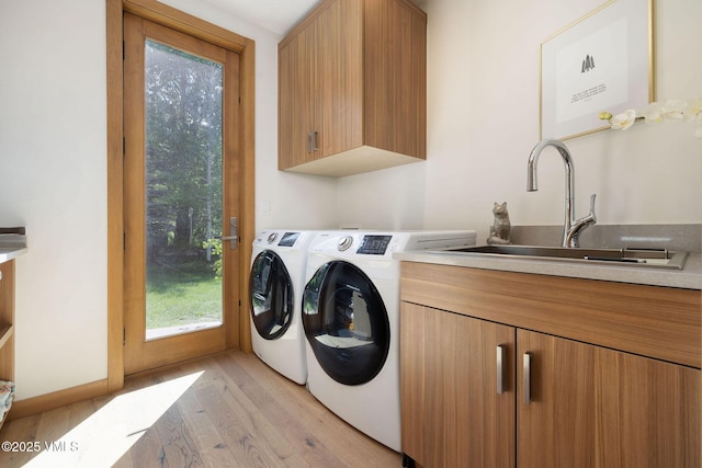 232 Stetson Dr, Edwards, CO 81632 - laundry area with cabinet space, separate washer and dryer, and light wood-type flooring
