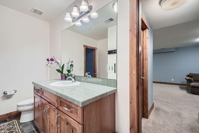 41 Wren Ct, Eagle, CO 81631 - bathroom with vanity, baseboards, and toilet